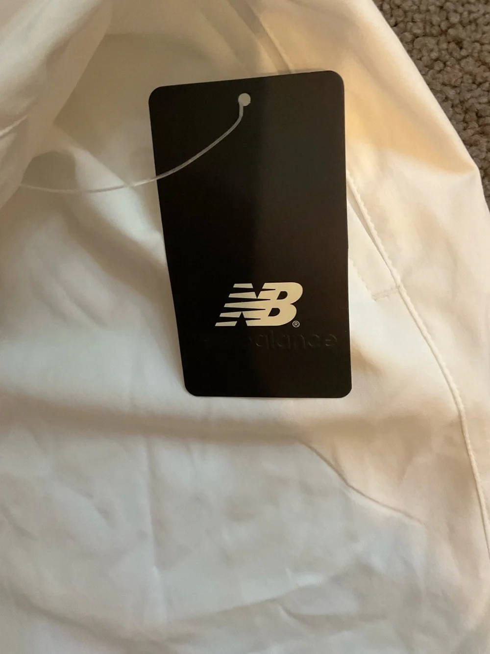 New Balance White Athletic Shorts with Black Logo Tag